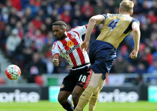 Jermain Defoe gets the better of Per Mertesacker in last season's Sunderland-Arsenal clash. Picture by Frank Reid