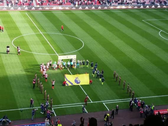 Members of the Armed Forces joined players on the pitch as a moment's silence is held ahead of today's kick off.