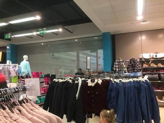 The shutters were put down inside Primark, stopping shoppers from moving between the store and The Bridges.