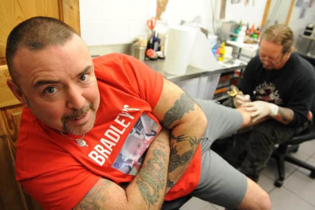 Eddie Goodwin and tattoo artist Phil Pescod.