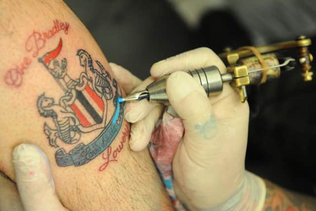 Eddie Goodwin gets his tattoo.