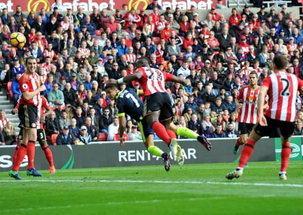 Alexis Sanchez beats Lamine Kone to the header to put Arsenal ahead. Picture by FRANK REID