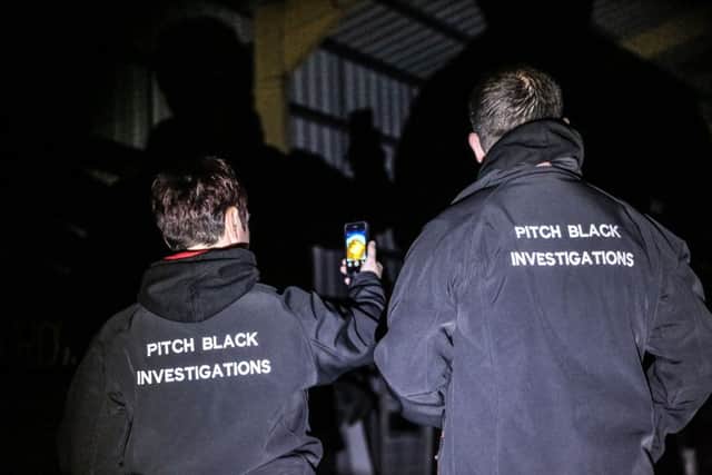 Members of the Pitch Black Investigations team, Carrie Archibald and Steve Archibald, on a ghost hunt in the North East Aircraft Museum. Picture: TOM BANKS