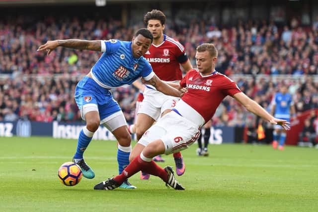 Ben Gibson makes a challenge against Bournemouth