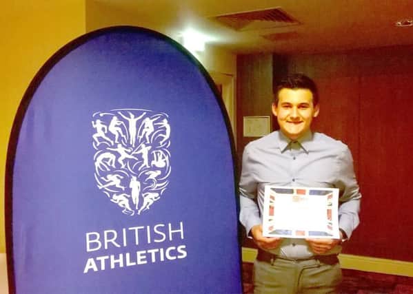 Houghton Harrier Dominic Ellis celebrated winning the England Athletics North East volunteer runner-up of the year award.