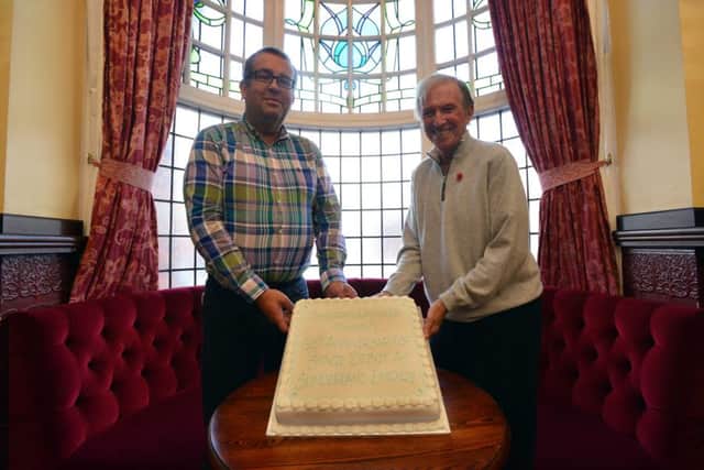 Tommy Steele with his 60th anniversary stage debut cake at Sunderland Empire with theatre general manager Ben Phillips.