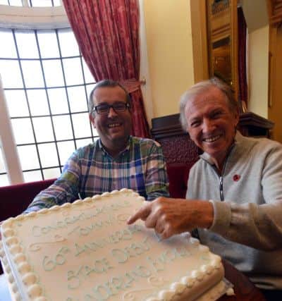 Tommy Steele with his 60th anniversary stage debut cake at Sunderland Empire with theatre general manager Ben Phillips.