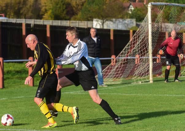 Dubmire (yellow and black stripes) attack against Seaham Marlborough in the Over-40s League at Dawdon Welfare Park last weeke
