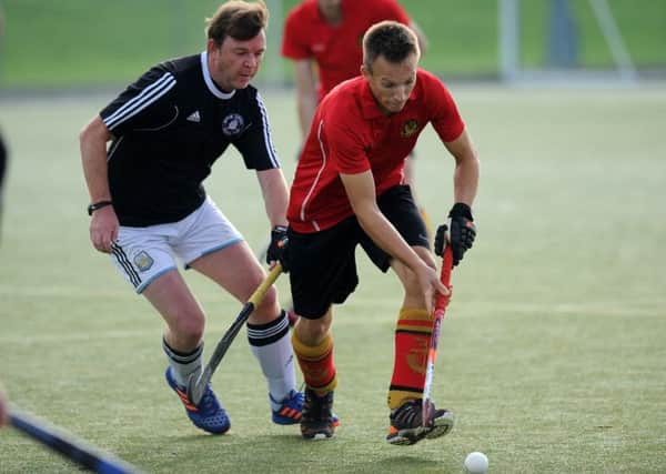 Sunderland Broom's Sam Middleton (red) takes on Marton Furness in their recent clash.