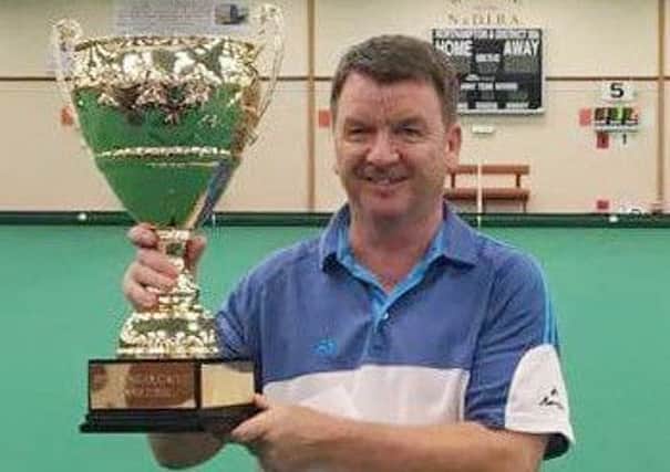 Gary Smith celebrates his victory in the Open Singles Circuit grand final in Northampton