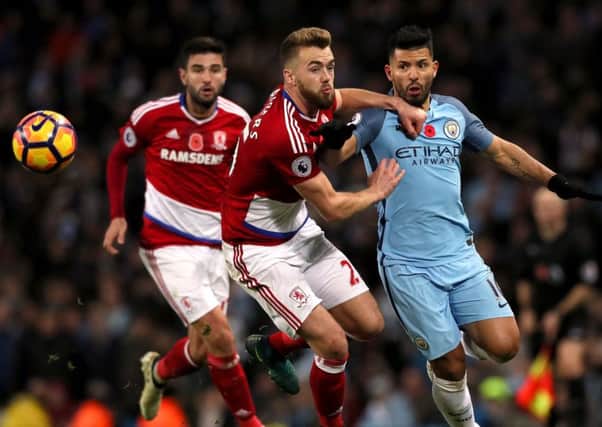 Boro's Calum Chambers tries to keep Manchester City star Sergio Aguero in check at the Etihad Stadium