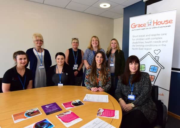 Southwck, Sunderland, "One Place, Your Space" pictured Jane Lertas-Robinson (seated 3rd left) Business Development Manager Grace House with parent carers, staff from Sunderland Carers Centre and therapists.