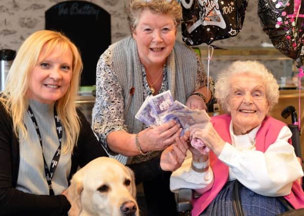 Charlotte Deacon donates funds to Blind Children UK from her 100th birthday collection.
From left Blind Children UK Guide Dogs Lorraine Donaldson and friend Anne Swales