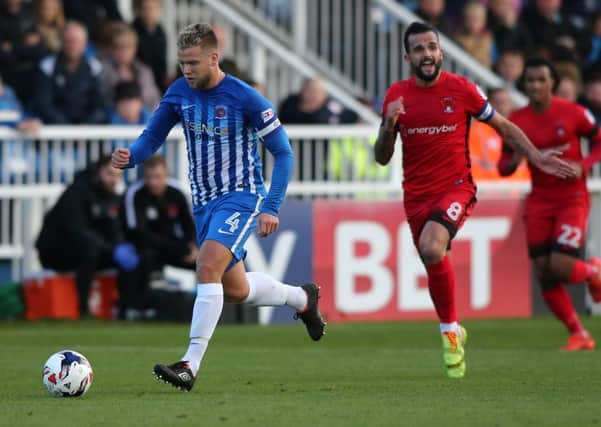 Pools' Nicky Featherstone gets away from the Leyton Orient midfield in the most recent home match. Picture by Tom Banks