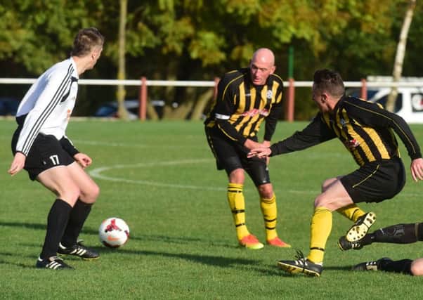 Dubmire (yellow and black) battle Seaham Marlborough in the Over-40s League last week