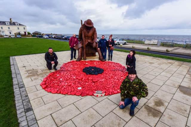 Volunteers who have painted stones from the beach at Seaham and made a poppy next to the Tommy statue, l-r Andrew Harrison, Philip Ridley, Dave Routlledge, Tracy Spencer, Alex Tinkler and Dave McKenna