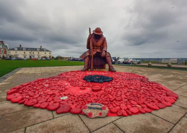 A  poppy made from stones collected from Seaham beachand arranged at the foot of the Tommy statue in Seaham, on Sunday