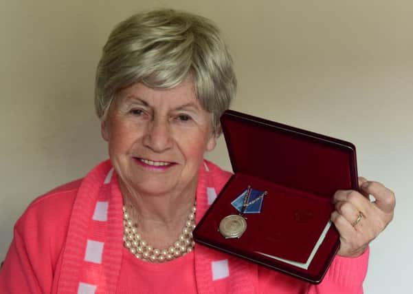 Maureen Brook, wife of the late John Brook, pictured with his medal from the Russian people thanking him for his service.
