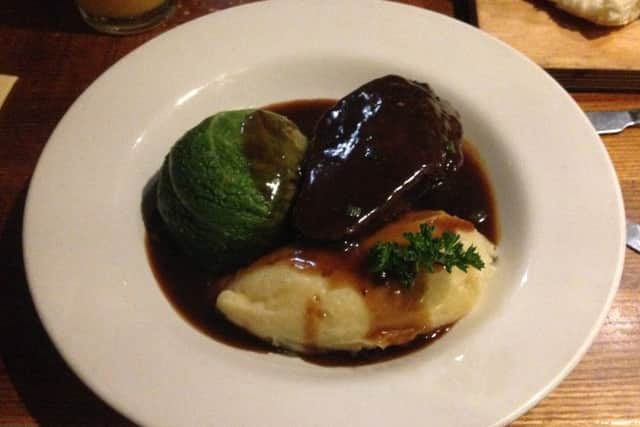 Braised featherblade of beef with a savoy parcel, mash and red wine jus.