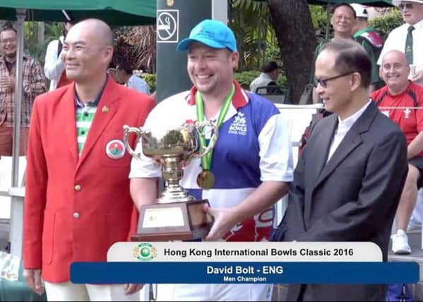 David Bolt (centre) prepares to receive his Hong Kong International Bowls Classic Trophy