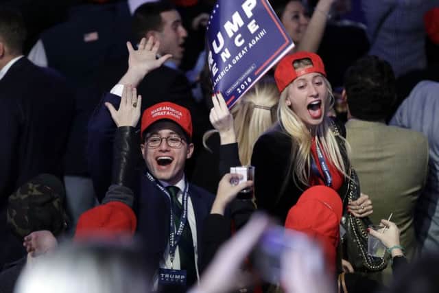 Donald Trump supports celebrating in New York as their candidate's win was announced. (Picture: AP Photo/John Locher).