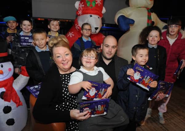 Hope4kidz Viv Watts and Illusions Nightclub's Joe Gullis are joined by youngsters from Sunningdale School to launch the Toy Appeal.
