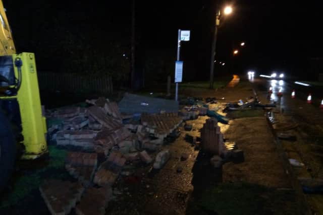 A bus stop was left a pile of rubble after the collision between two cars which claimed the life of one of the drivers.
