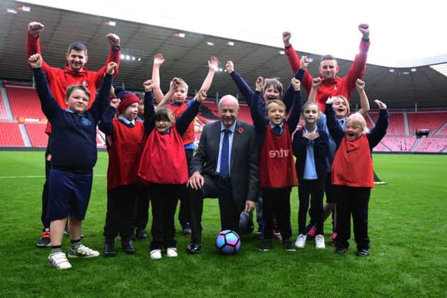 Work and Pensions Secretary Damian Green with youngsters who have been taking part in training with the Foundation of Light