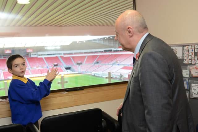 Work and Pensions Secretary Damian Green meets Nathan Shippey, who inspired the creation of the stadium's sensory room