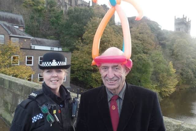Children's entertainer Alfred Hill, with PC Jayne Marshall who is hoping to trace the man who threw Alfred's horseshoe puzzle into the Wear in Durham.