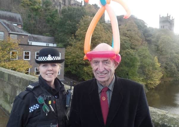 Children's entertainer Alfred Hill, with PC Jayne Marshall who is hoping to trace the man who threw Alfred's horseshoe puzzle into the Wear in Durham.