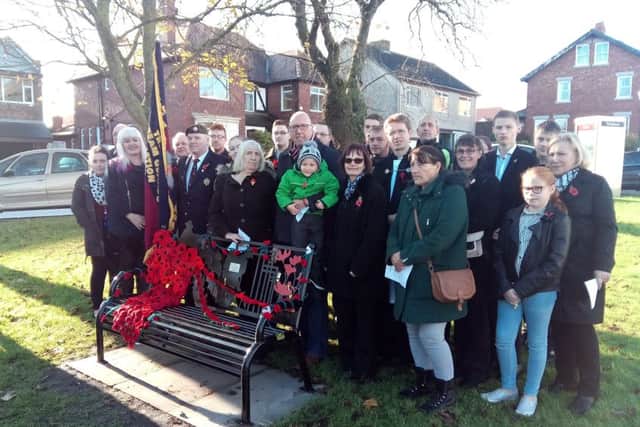 The family of Acting Sergeant John Amer gather around the new bench in Ryhope.
