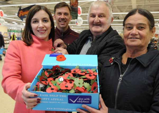 MP Bridget Phillipson receives her poppy from Royal British Legion members Bobby Newton and Elaine Griffin, at Sainsbury's Silksworth, with Rob Fraser.