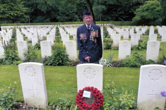 Frank Whyman  pictured at his brother Arthur's grave in the Reichswald Forest War Cemetery.