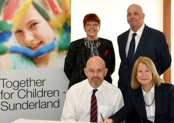 Nick Whitfield, commissioner of children services, Sunderland City Council, and Irene Lucas CBE, council chief executive, signia Children Services Memorandom of Understanding alongside Councillor Louise Farthing and Paul Watson, council  leader.