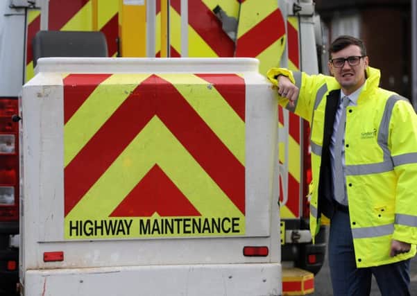 Sunderland City Council Cabinet Member for City Services Coun Michael Mordey pictured with a highway maintenance van in Hetton.