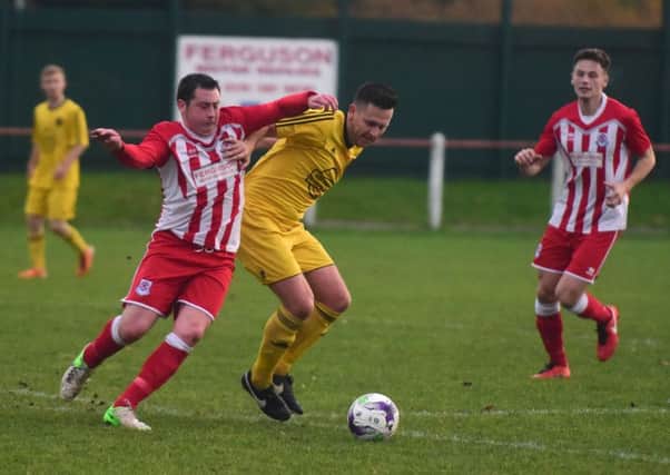 Seaham Red Star (red/white) battle West Auckland in the Northern League last weekend. Picture by Kevin Brady