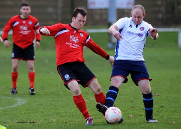 Silksworth CW (red) take on Redcar Athletic last weekend. Picture by Tin Richardson