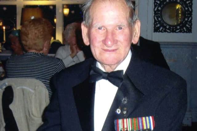 Frank Whyman wearing his medals.