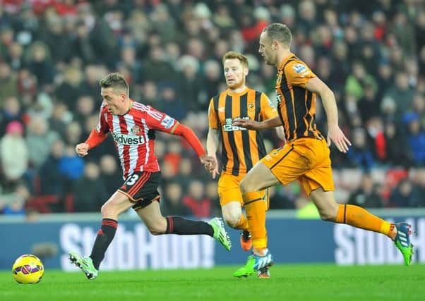 Emanuele Giaccherini tries to get away from Hull City's David Meyler and Stephen Quinn in the last meeting of the clubs at the Stadium of Light, in December 2014. Picture by Frank Reid