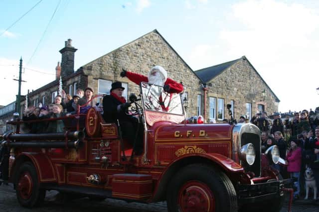 Father Christmas arrived into Beamish on a vintage fire engine.