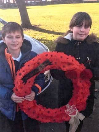 Pupils from Ropery Walk Primary School pupils with their wreath.