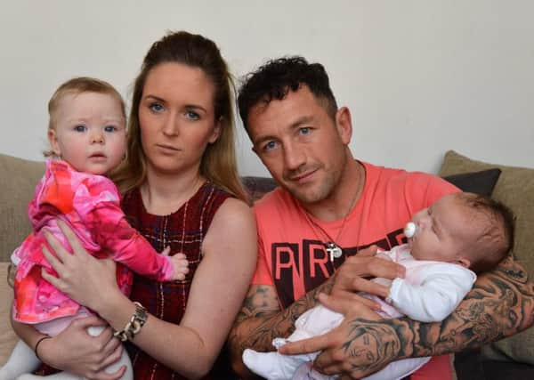 Mother Amy Agnew has made a hospital complaint over the treatment of her eight-week-old daughter Scarlett. They're pictured with her partner Steven Gardener and their other daughter, one-year-old Esmae.