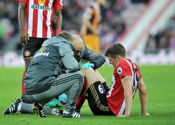 Sunderland's Paddy McNair receives treatment.