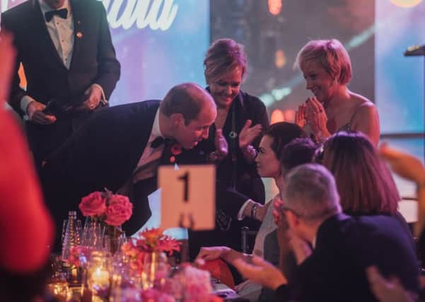 The Duke of Cambridge Prince William speaks to Carly Scott at the awards ceremony.