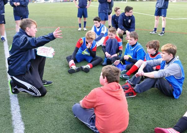 Youngsters get a briefing from their coach during an FA competition in the North East.