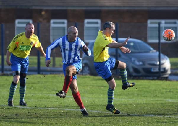 Ryhope Foresters (yellow shirts) battle against Hartlepool Touchdown in the Over-40s League last week.