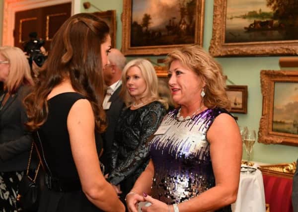 Former headteacher at Southwick Community Primay School, Trish Stoker, meets HRH the Duchess of Cambridge.