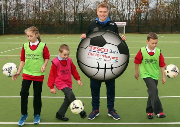 Sunderland's Duncan Watmore joins up with youngsters to launch the Tesco Bank Junior Players community programme.