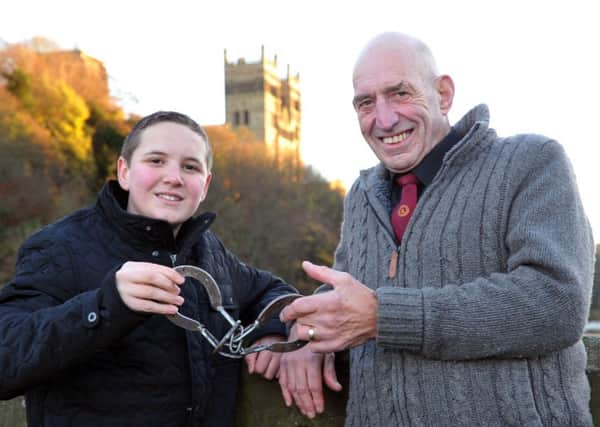Magician Alf Hill thanks Jonathan Lambert for retrieving his magic trick from the River Wear, below Framwellgate Bridge, Durham City.